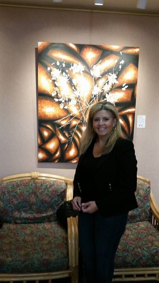 Isa Garcia with one of her large-format works